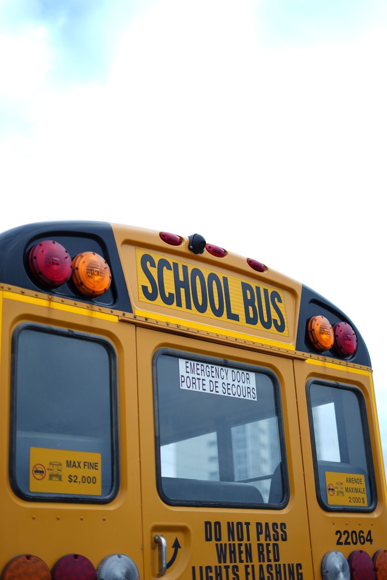 A classic yellow school bus parked in Kitchener, Ontario, Canada. Ideal for back-to-school themes.